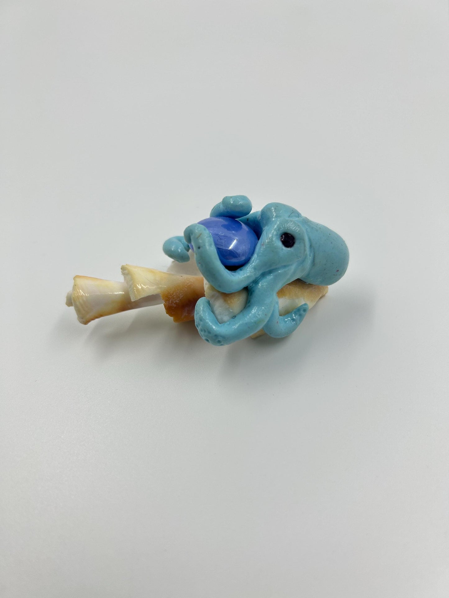 Octopus Sculpture – Handmade polymer clay octopus on seashell holding orb. Whimsical ocean art décor & sea lover gift.